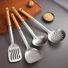 Stainless Steel Cookware Set: Spatula, Soup Ladle, Slotted Spoon with Orange-Brown Wood Handle.