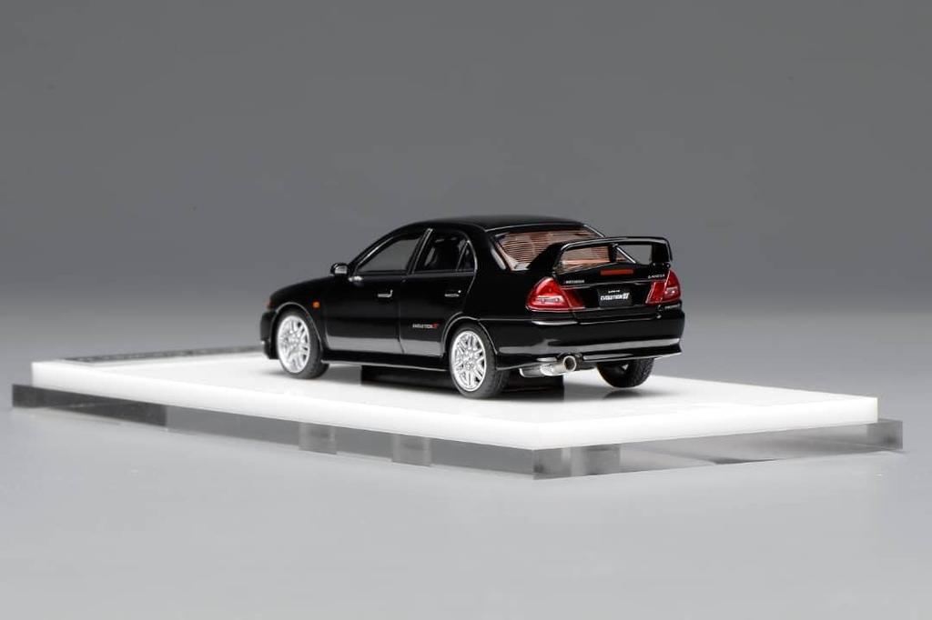 FREESTYLE MOTORHELIX Mitsubishi Lancer Evolution IV Pyrenees Black Pearl Finished Model M64004 1/64