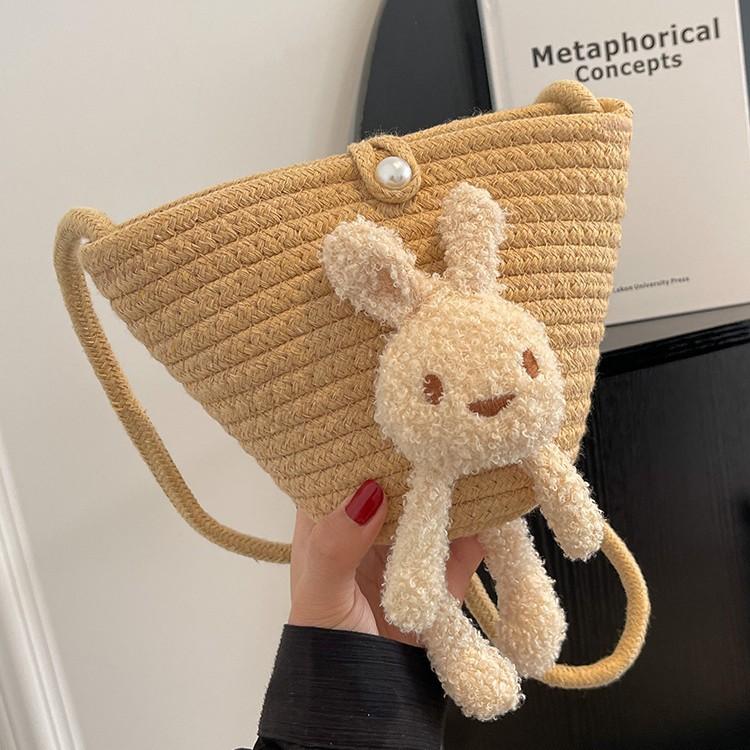 Summer cute oblique bucket bag women's straw woven outdoor travel beach bag versatile plush rabbit shoulder bag