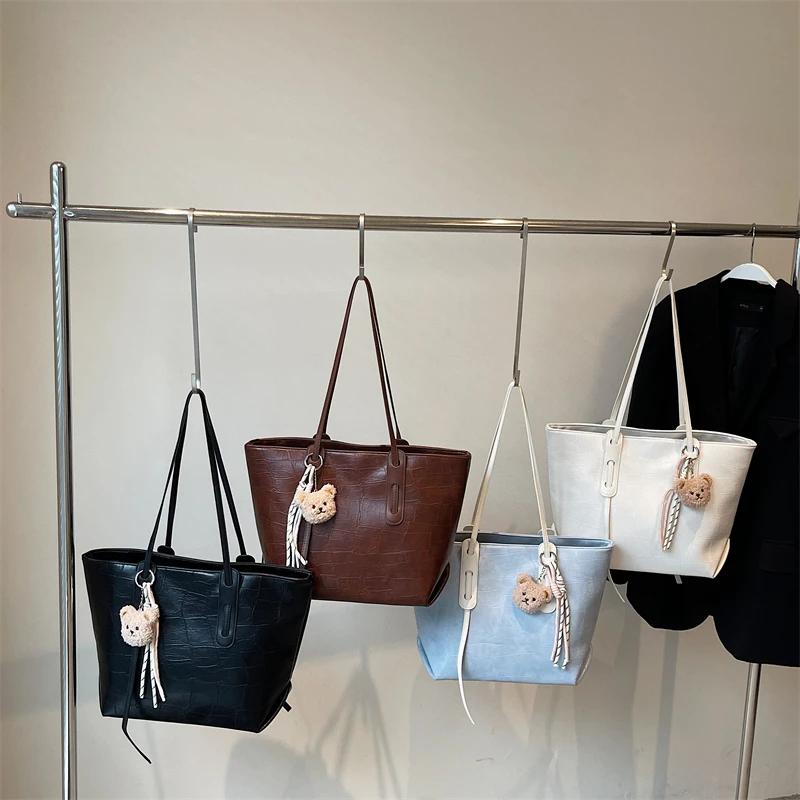 Sommer Neue Einfarbige PU Süße Elegante Leichte Luxus Tragetasche Modische und Einfache Pendel-Freizeit-Schultertaschen für Damen