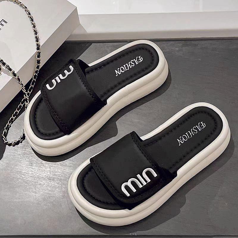 

2025 summer new Internet celebrity casual slippers women wear muffin thick bottom one-word drag explosion sandals student versatile 35 чорний