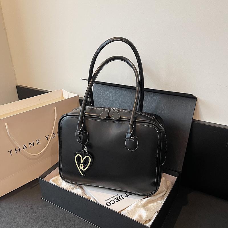 Nové podzimní dámské tašky s vysokou kapacitou a pokročilou texturou, jednobarevné, s dobrým vzhledem, jednoduché univerzální tašky přes rameno