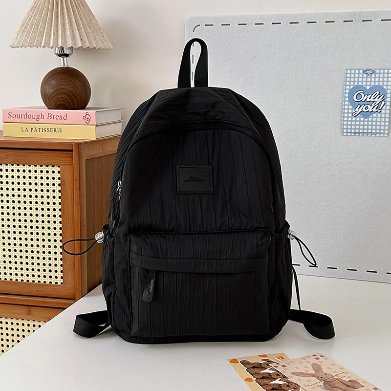 School bag junior high school girls large capacity solid color light primary school backpack high value girl versatile backpack