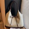 Retro commuter niche bow single shoulder armpit bag new fashionable and simple contrasting color tote bag
