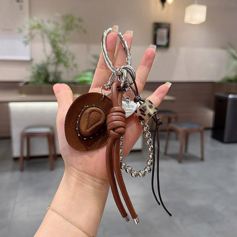 Glücksbringer Cowboyhut Schlüsselanhänger Anhänger Handgeflochtenes Seil Kunstleder Charm Glücksbringer Dekoration Für Autoschlüssel Tasche Geldbörse