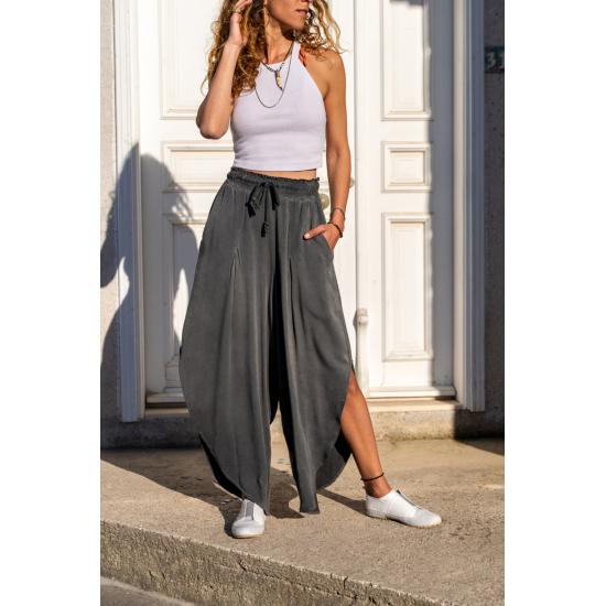 

Женские протертые карманы, боковые разрезы, эластичный пояс, свободные брюки из шальвара