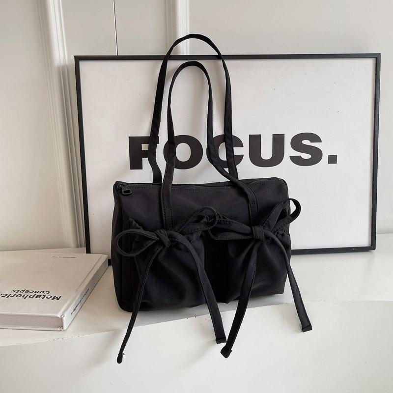 Nova bolsa tote com laço, senso de alta qualidade, bolsa de ombro de grande capacidade, bolsa axilar feminina simples de cor sólida para o dia a dia