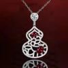 Light Luxury Ruby Necklace, Colored Treasure Earrings, Hollow Pattern Fulu Red Diamond Gourd Pendant, Simulated Emerald Set.