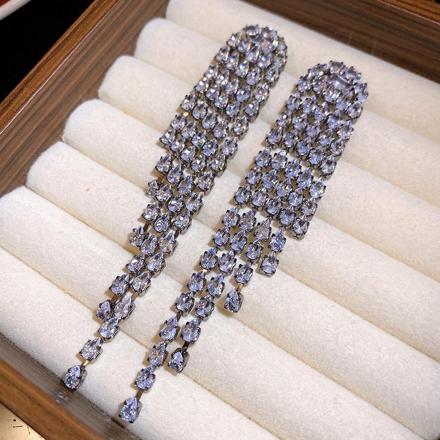 

Silver needle zircon water drop fringed earrings European and American niche exquisite fashion versatile earrings light luxury high-end earrings women