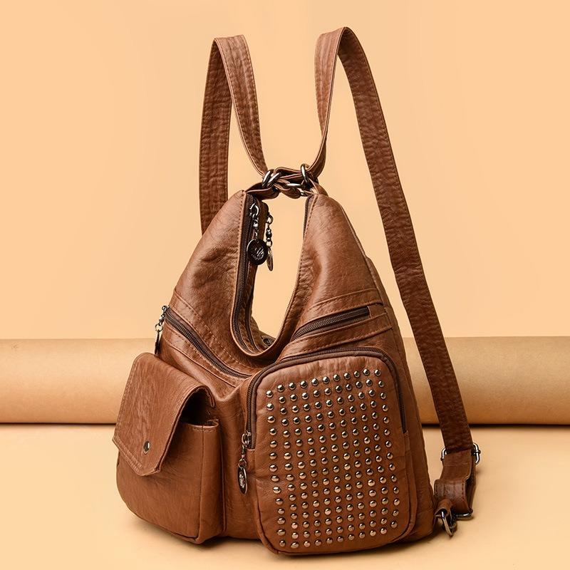 

Очарование расцветает! Новый однотонный женский рюкзак с мягкой отделкой и заклепками представляет собой идеальное сочетание моды и практичности. коричневый