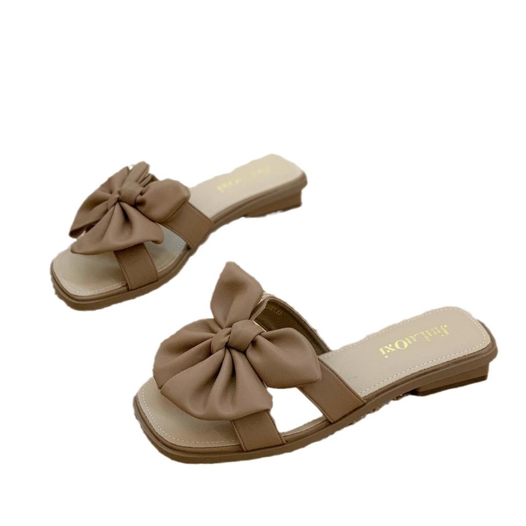Stepping on shit slippers women wear 2025 new summer Internet celebrity fairy wind bow wedge soft bottom one-word