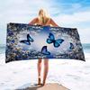 A women's oversized beach towel that is soft quick-drying and super absorbent with a beautiful butterfly and flower design