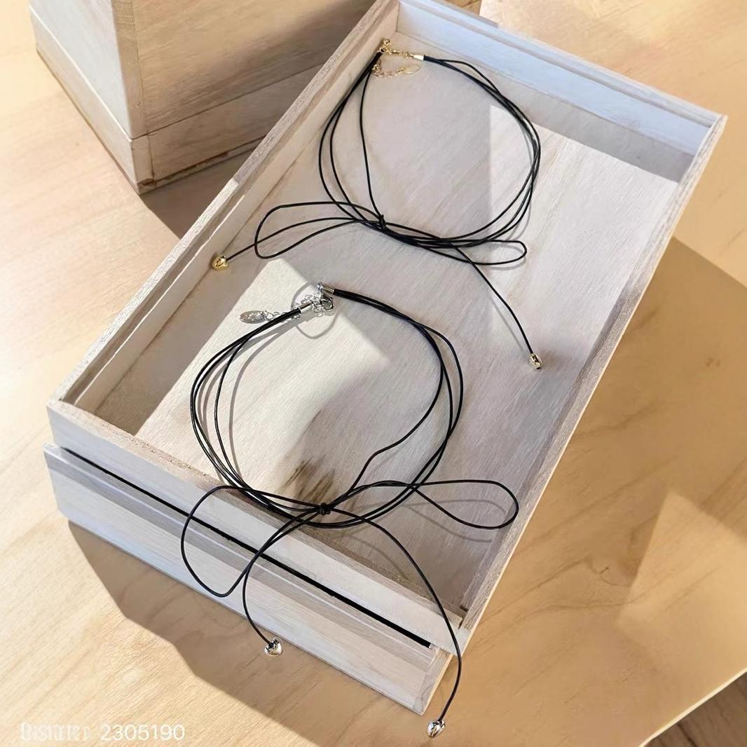 

Korea Dongdaemun REINA sweet cool wind small love pendant bow multi-layer black rope necklace necklace collar срібний