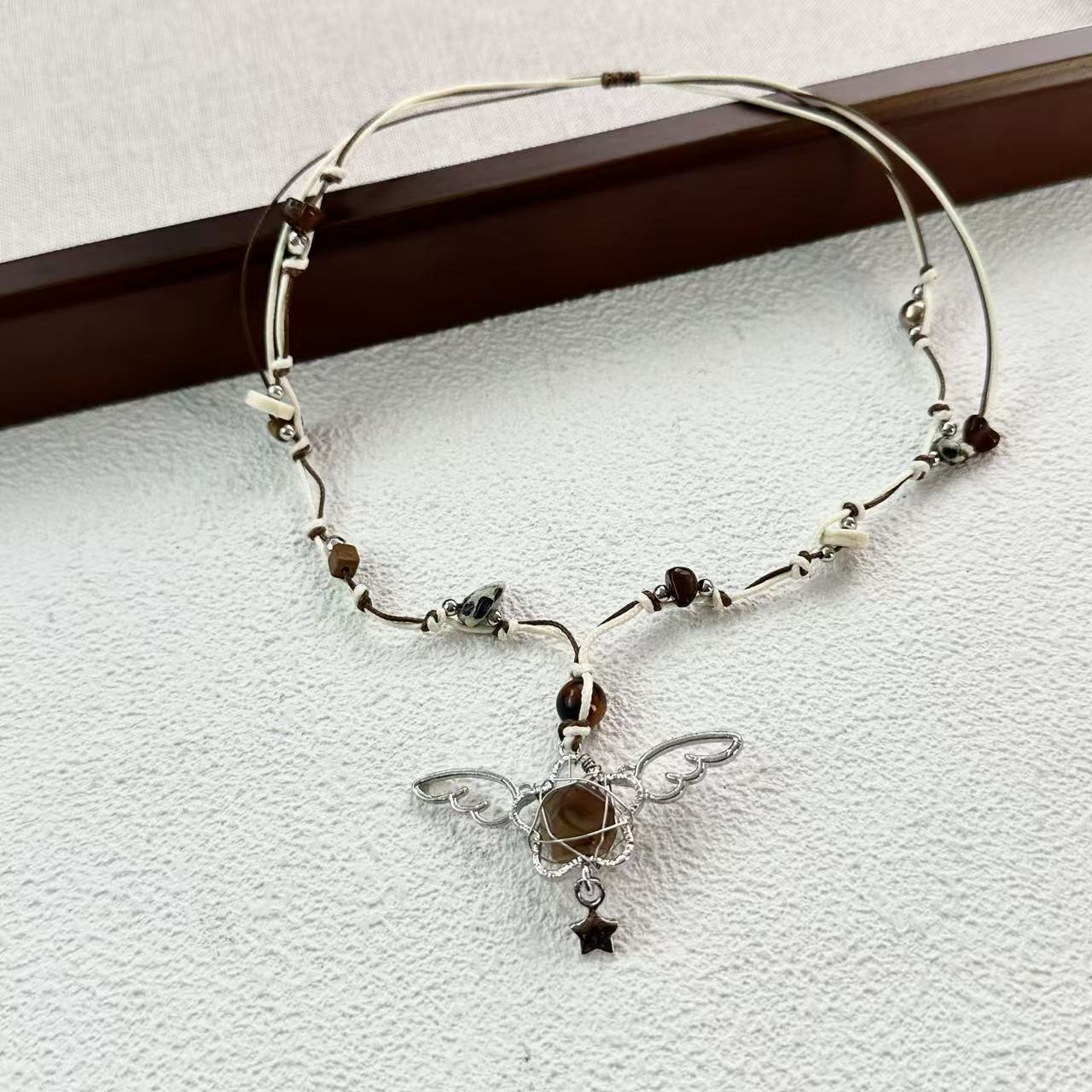 

Retro Fashion Sliver Color Hollowed-out Five-pointed Star Angel Wing Pendant Adjustable Braided Rope Necklace for Women Jewelry коричневый