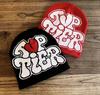 Casual Hip Hop Style Cap Bold Black Lettering with Red Heart Graphic Custom Logo Elastic Knitted Unisex Jacquard Beanie