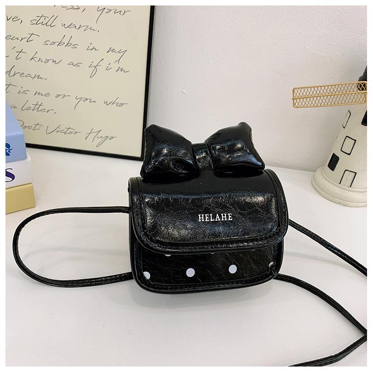 

Набор детской сумки кроссбоди с бантом в горошек и кошелька для монет чёрный