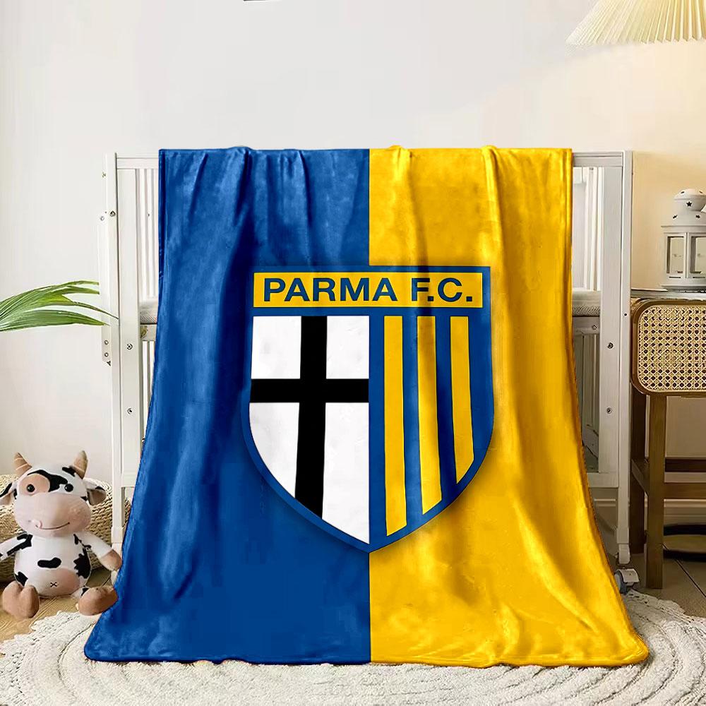 A shield logo with a black cross on white and yellow stripes on blue. for all seasons blanket lunch break throw gift