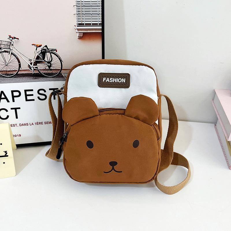 

2025 new fashion nylon cute mobile phone bag vertical versatile splicing single shoulder ugly cute small bag messenger bag коричневый