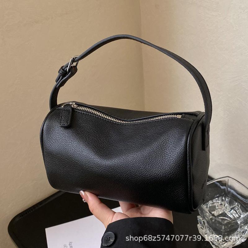Korean version wide shoulder strap cylinder bag women's 2025 spring new niche pillow bag fashionable versatile single shoulder messenger bag