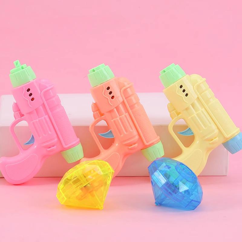 

Glow-in-the-Dark Gyroscope Pistol: Creative Night Market Toy for Kids