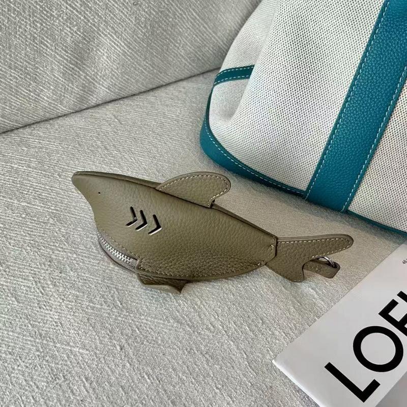 New leather dolphin change bag, keychain pendant, cute fashion earphones, lipstick storage bag.