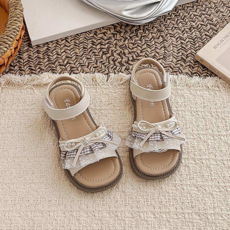 

Girls open-toe sandals2026Summer New Pearl Princess Sandals with Lace Trim and Cute Little Bow 31-37Code one hand7Double бежевий
