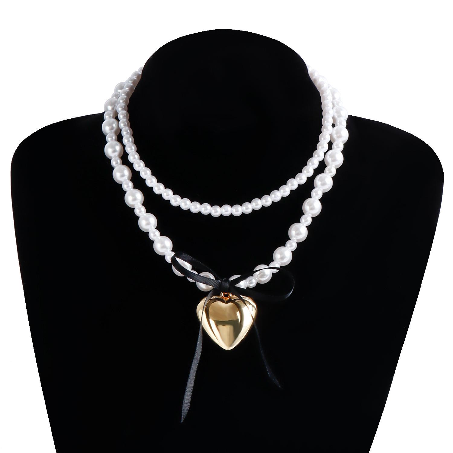 

European and American sweet and cool style black silk ribbon bow love necklace female niche high-end imitation pearl necklace золотий