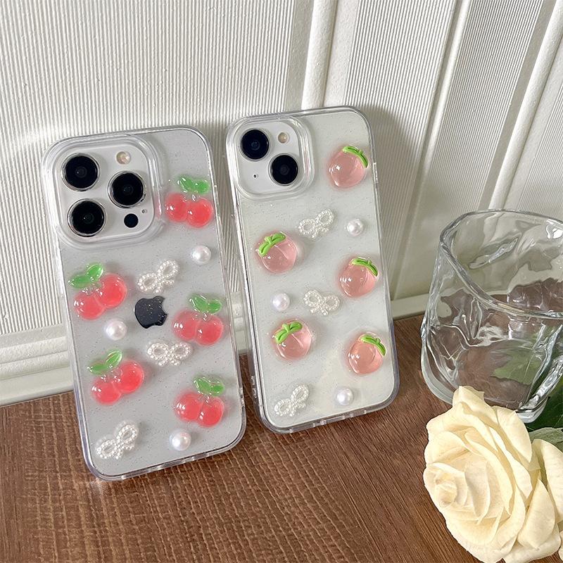 Cherry and Peach Mobile Phone Case Is Suitable for Apple 17Promax Glitter Pearl Iphone16 Bow Tie Transparent Women's Model.