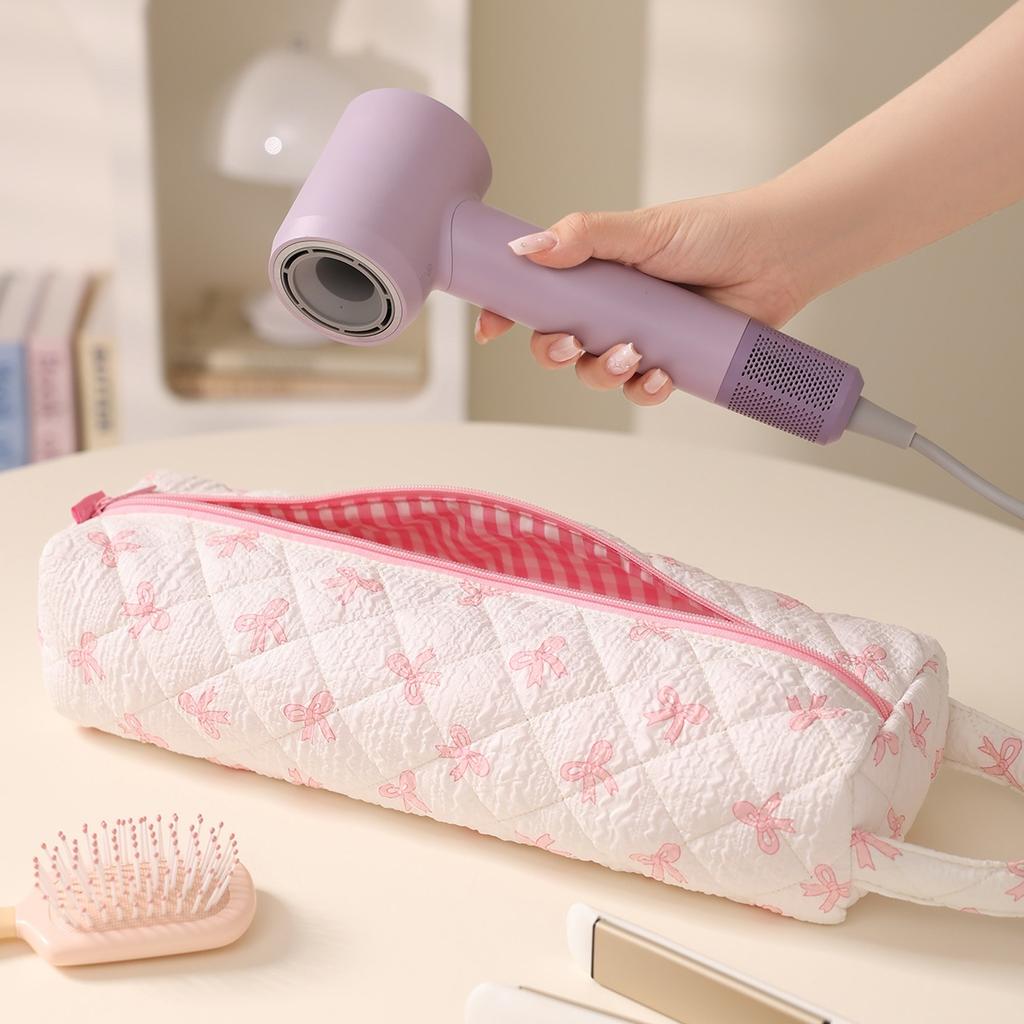 Aufbewahrungstasche für Haarpflegegeräte mit Reißverschluss und Schleifendesign. Staubdicht für Haartrockner und Styling-Werkzeuge, ideal für Reisen und den täglichen Gebrauch.