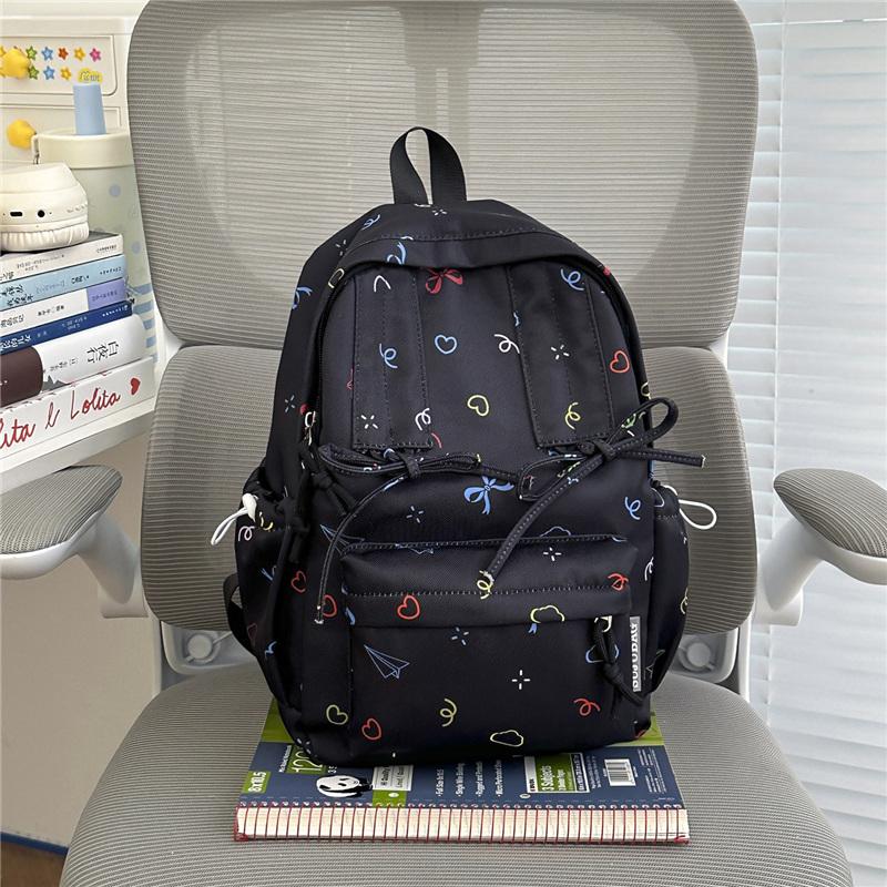 Cute Bow Tie Print School Backpack Lightweight Nylon Zipper Daypack with Front Pocket for Teen Girls Daily Travel