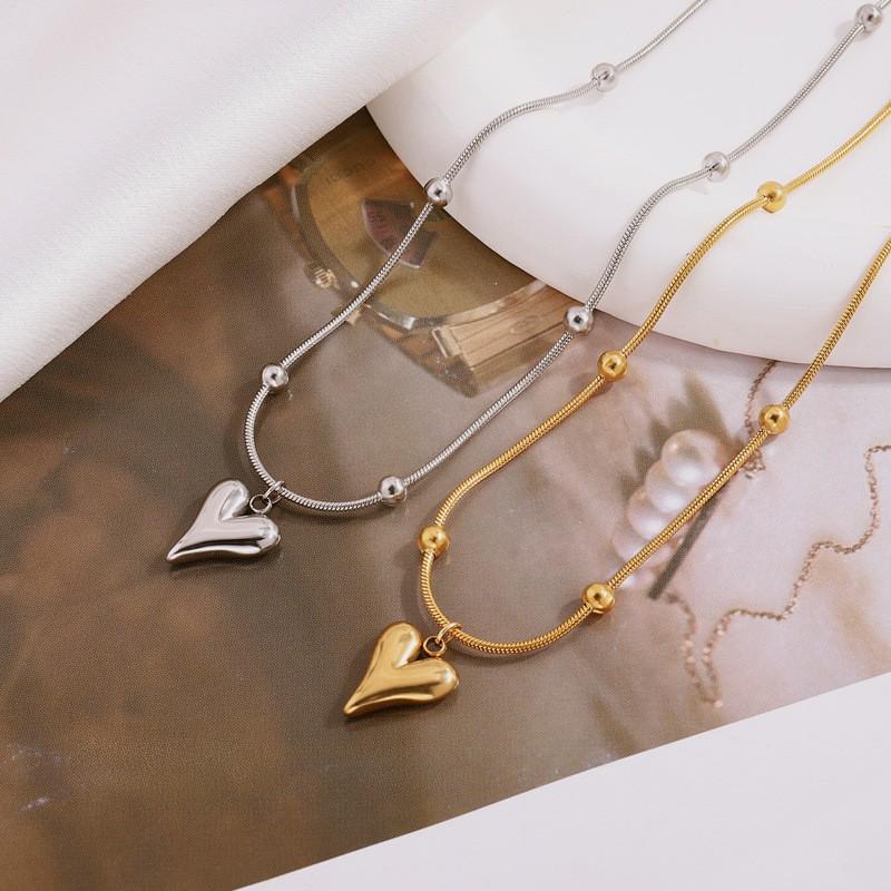 Elegant Titanium Heart Necklace - Light Luxury Women's Stainless Steel Jewelry, European & American Niche Design.