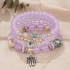 Bohemian Multi-layer Beaded Bracelet with Cross, Evil Eye, Palm Pendants, and Crystals.