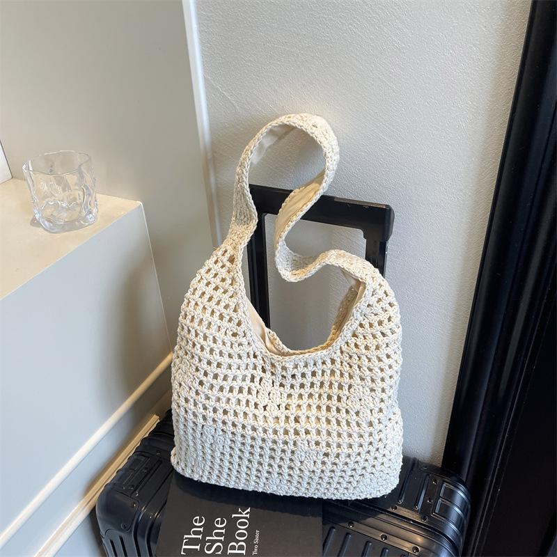 

Woven straw bag women s large-capacity new hollow shoulder shopping bag lazy wind seaside beach bag