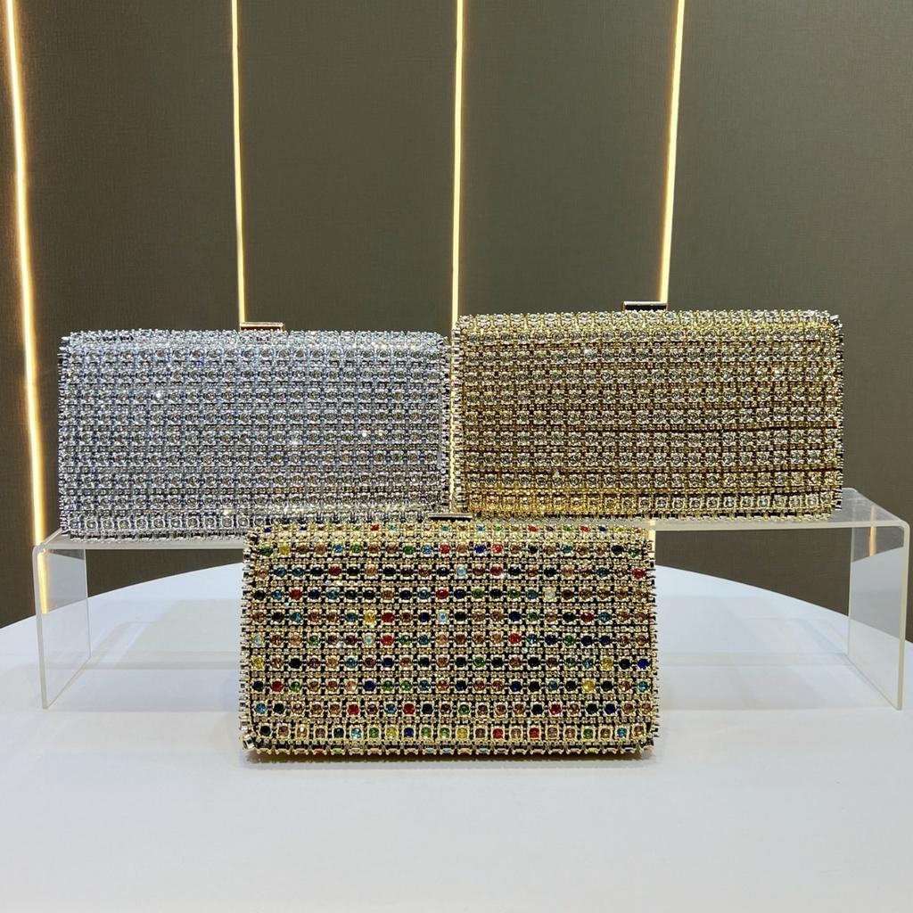 Lady Holding A Fashionable Evening Bag. Designer Water Droplet Chain Handbag for Ladies. Shoulder Bag for Ladies. Casually