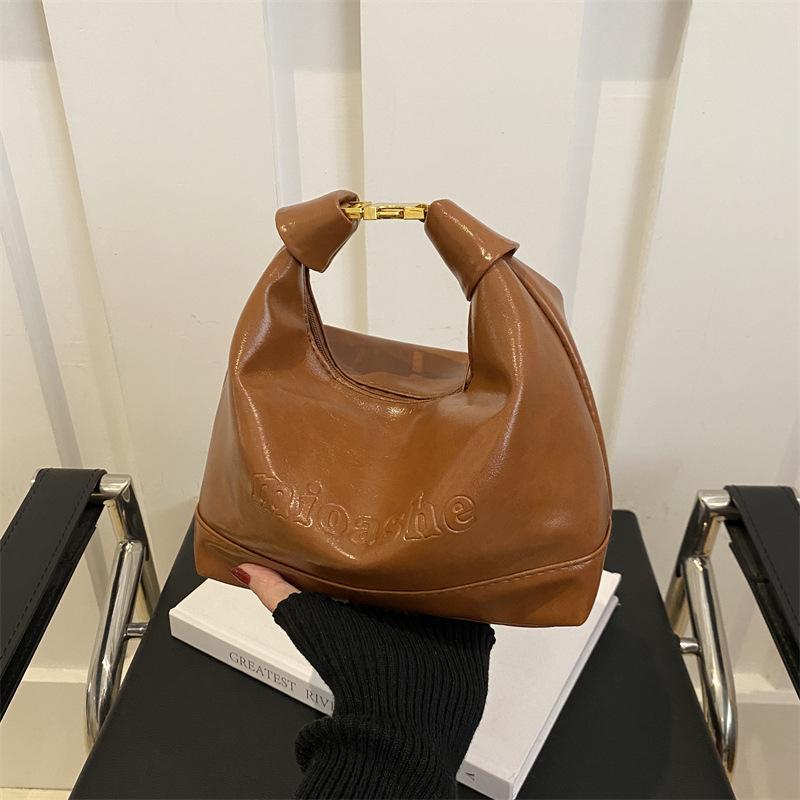 

Premium sense niche brown bag women s 2025 new autumn and winter shoulder messenger bag retro mini portable dumpling bag коричневий