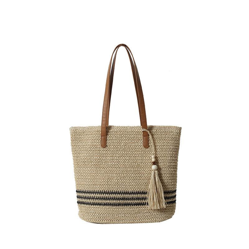 

Fashion travel personality woven stripes contrasting colors fringed women s commuter bag spring new women s shoulder handbag
