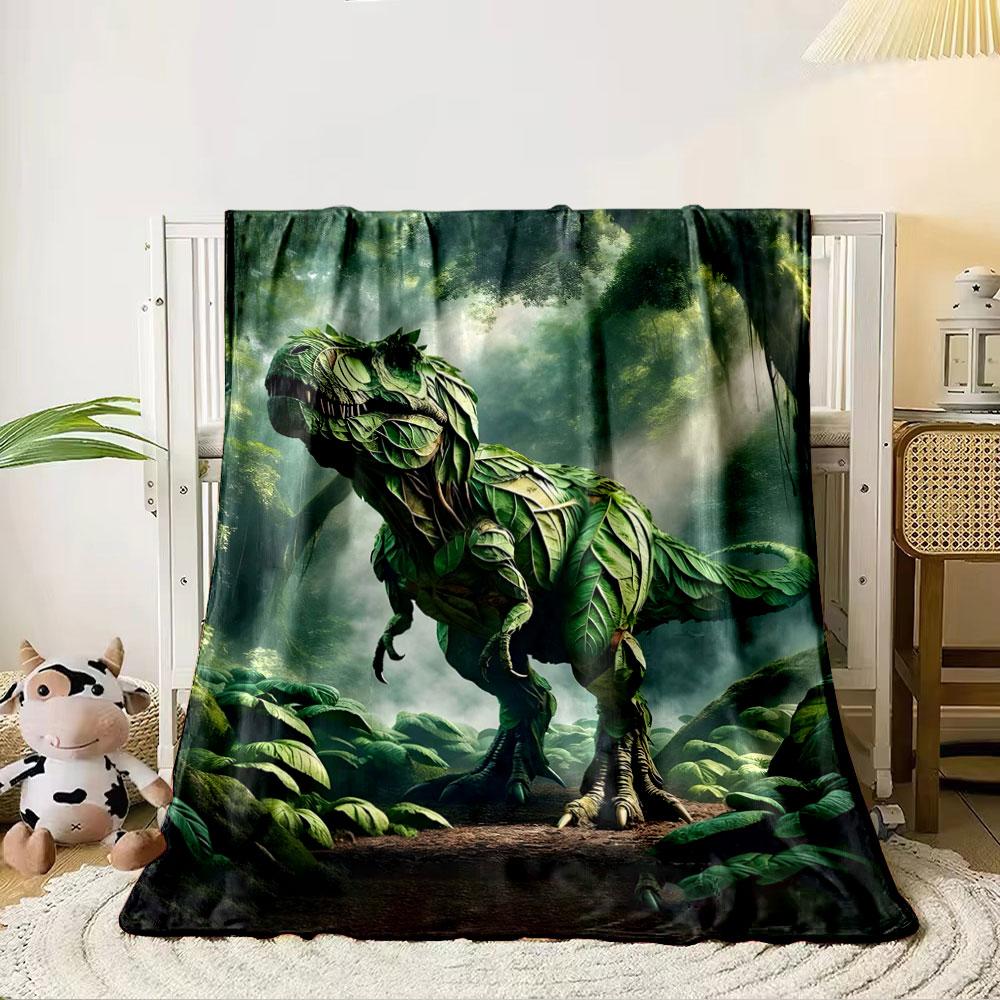 A dinosaur-shaped figure created entirely from overlapping green leaves. for all seasons blanket lunch break throw gift