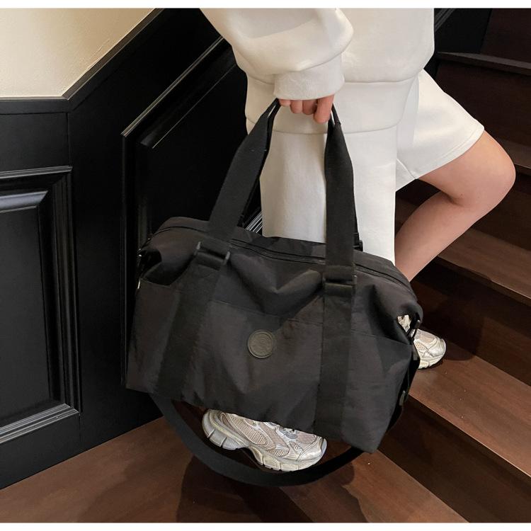 

Canvas bag women s 2025 new casual messenger business travel luggage high-end sense versatile large-capacity short-distance travel bag 42*17*30 чорний