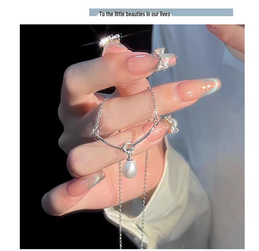 S925 Sterling Silver Freshwater Pearl Knot Necklace for Women - High-End, Versatile Clavicle Chain with Niche Design.