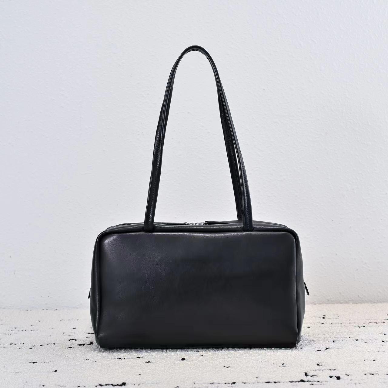 

2025 Новинка Нишевый дизайн ROW Минималистичная сумка-боулинг из овчины высшего слоя на одно плечо/подмышку Премиальная сенсорная сумка для общения 30x20x10cm чёрный