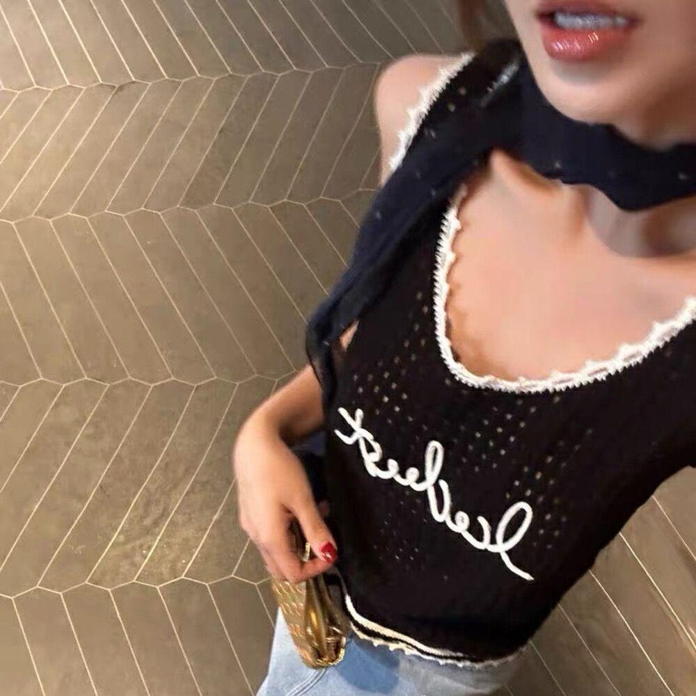 A Versatile Sleeveless Knitted Vest, Waistcoat and Black Top Are Fashionable