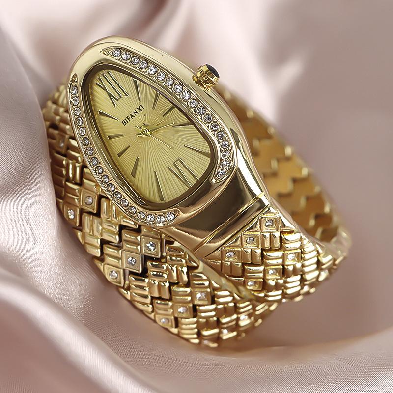 

Snake Wrap Women s Watch Fashion Personality Three-Hand Quartz Watch Niche Snake Head Diamond Gold Watch Subdial золотой