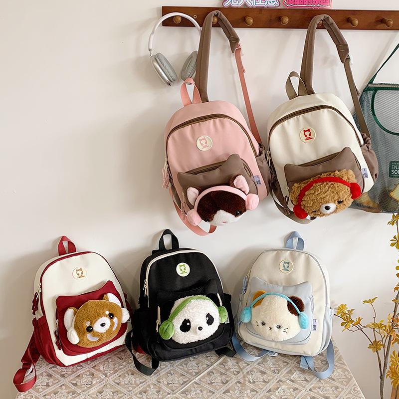 Cute Cartoon Trendy Backpack: Large Capacity, Lightweight, Versatile Travel/School Bag with Earphone and Doll Holder.