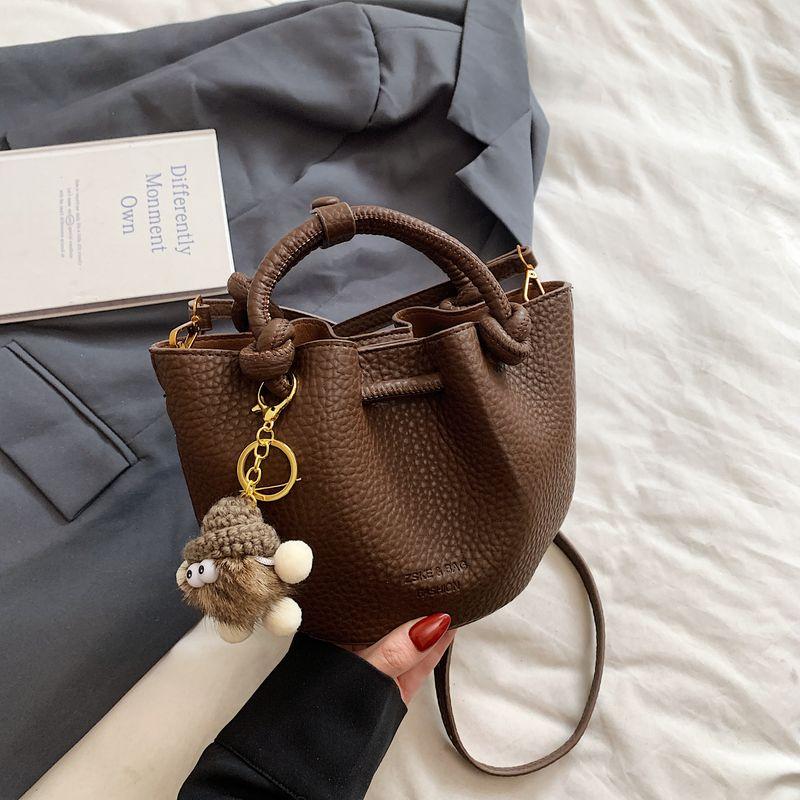

Best Selling Red Lightweight Bucket Bags Women s 2025 New Arrival Super Hot Light Luxury Minority Fancy Non-Collision Messenger Bag Brown + pendant