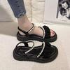 Stepping on shit sandals women's summer 2025 new beach shoes ins trendy fairy wind flat bottom wear non-slip Roman sandals