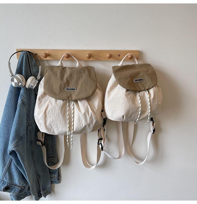 Contrasting color cloth backpack, women's 2025 summer new student commuting lazy style fashion versatile handbag