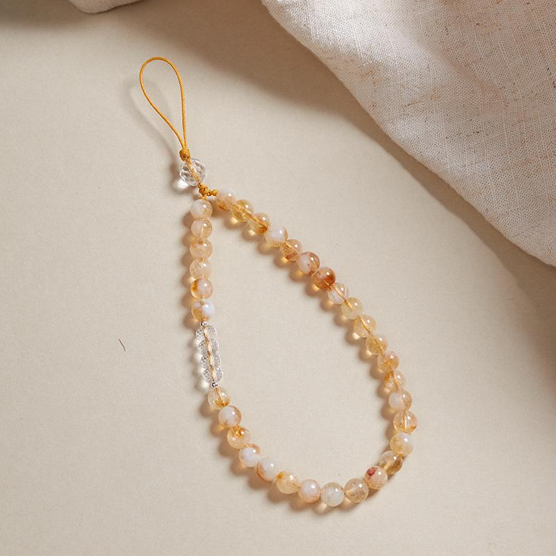 

Natural yellow crystal phone strap wrist cord for women, beaded phone chain with a high-end feel, crystal pendant phone case accessory Honey milk foam-Citrine