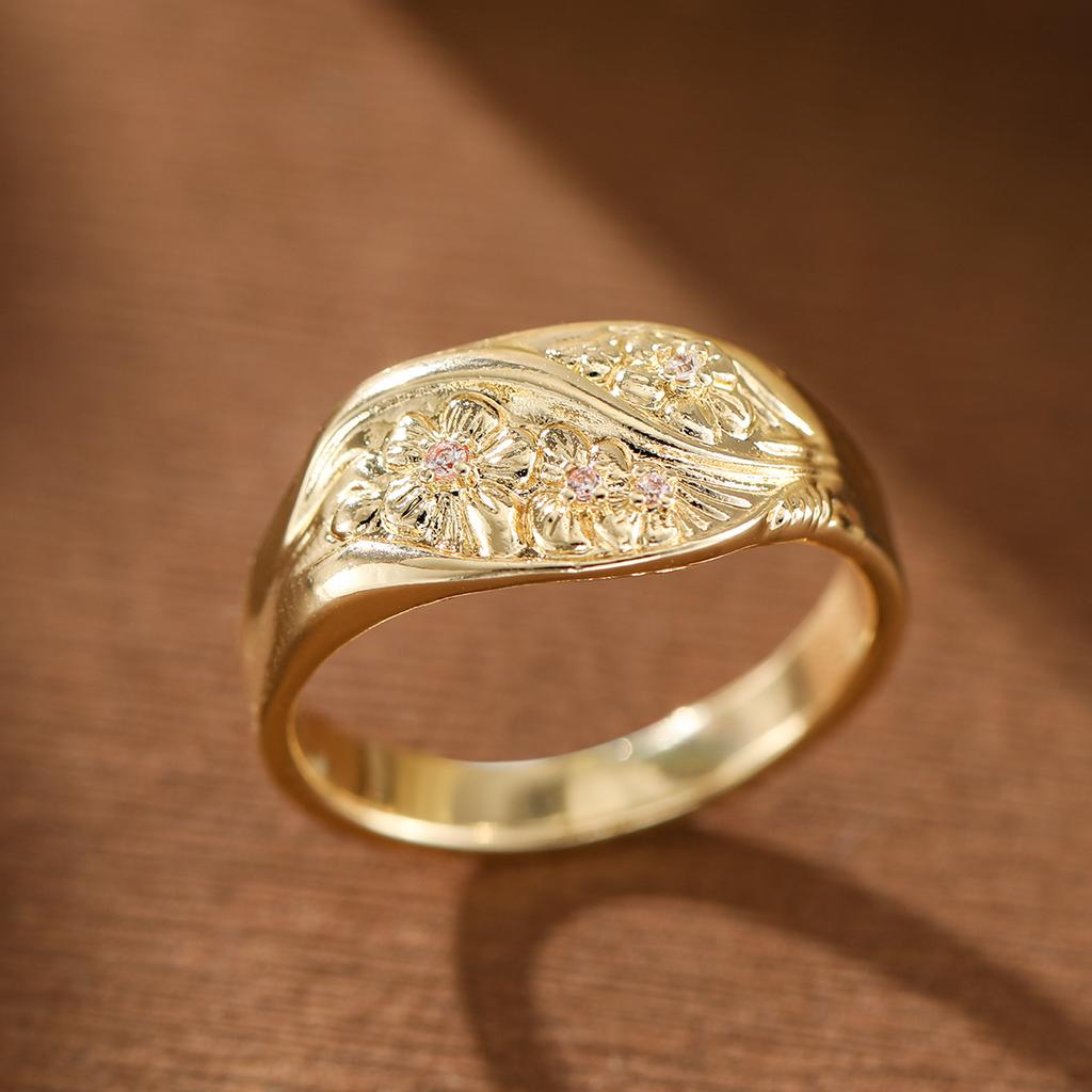 Retro-style relief flower-shaped artificial gemstone ring made of copper, suitable for ladies as a gift for shopping or dating.