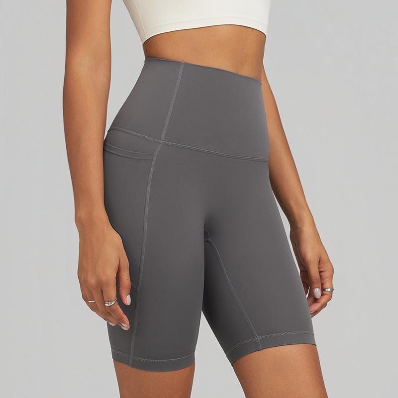 JOOMON Women's Quick-Dry Butt Lifting Yoga Shorts with Pockets for Running, Cycling, and Sports.