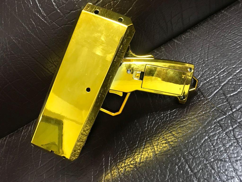 Gold Money Gun: Electric Cash-Spraying Toy for Fun and Relaxation